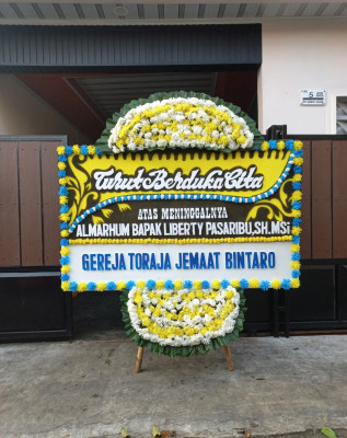 Papan Bunga Duka di Manutapen